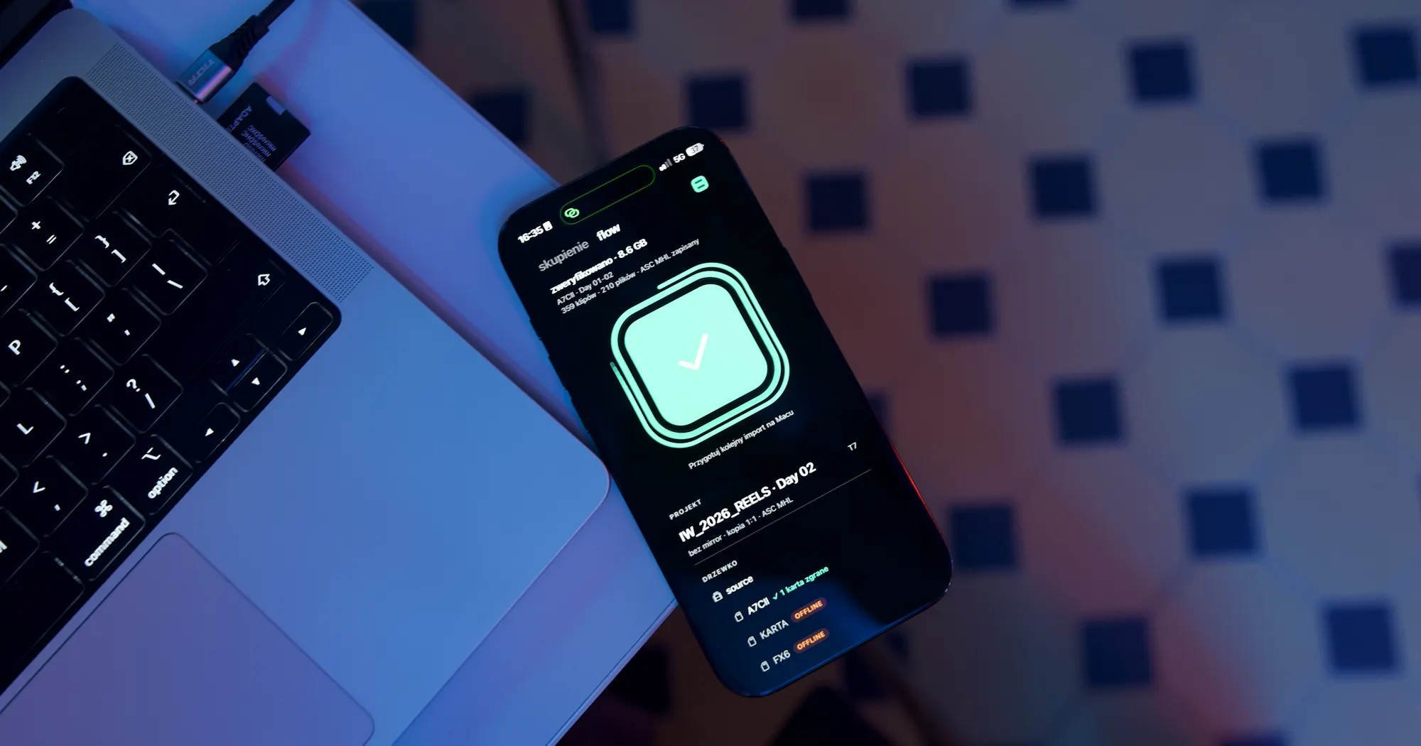 iPhone next to a MacBook, Habitat Flow shows a verified A7C II card in the IW_2026_REELS project, Day 02