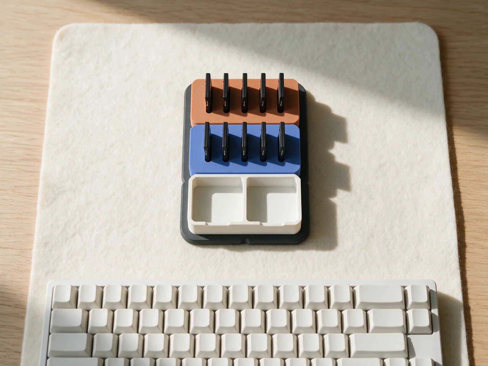 A habitat module with cards in its blocks, on a desk next to the keyboard